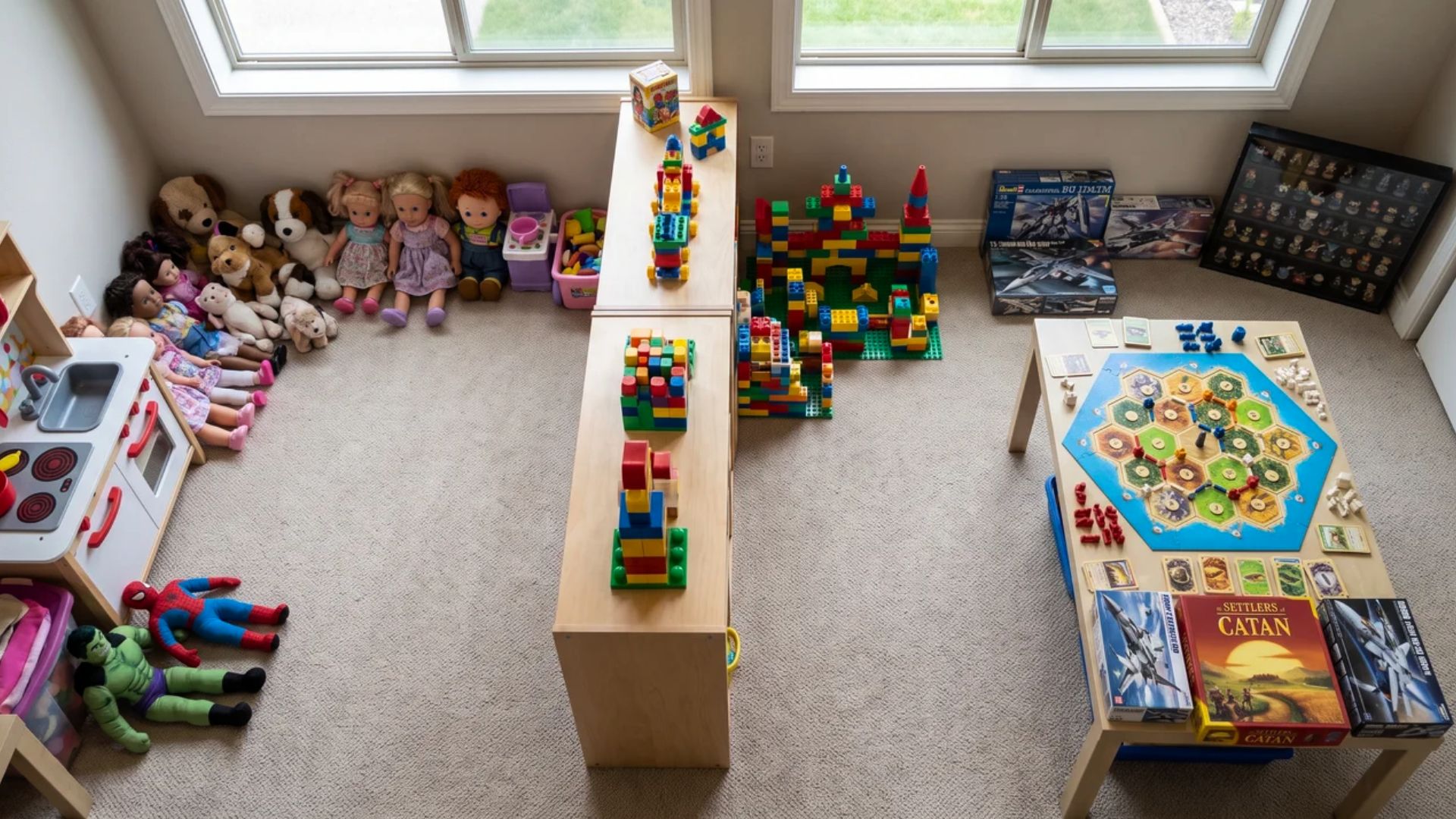 Dolls, action figures, building sets, collectibles, and strategy games arranged in a play area. 