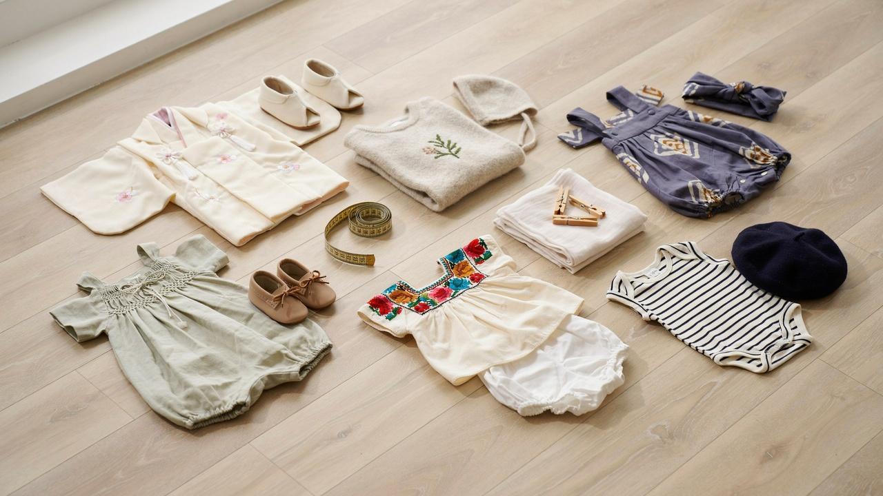 Baby clothes representing European, UK, and international sizing.