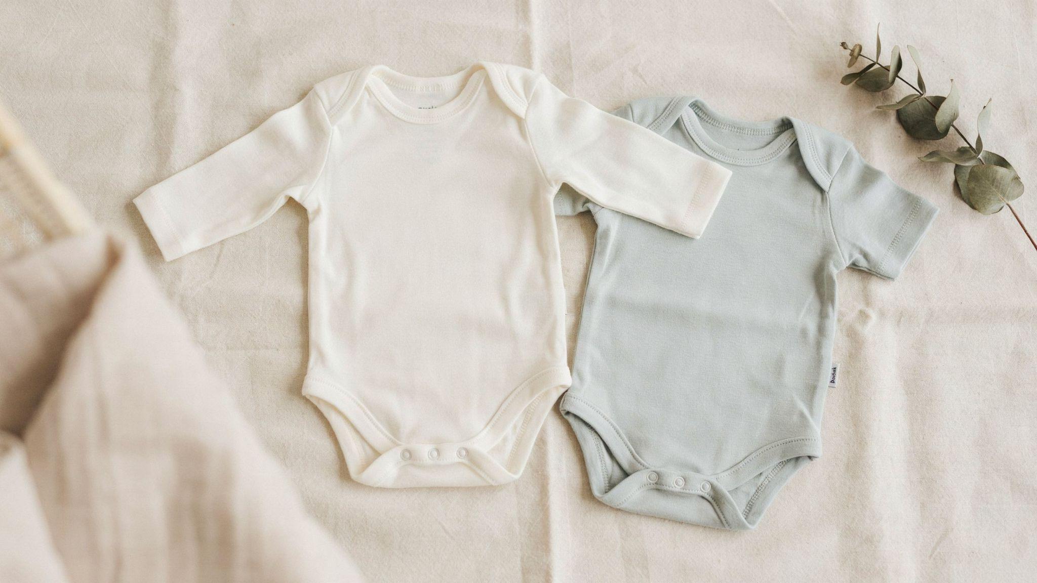Long-sleeve and short-sleeve newborn bodysuits made from soft breathable cotton fabric