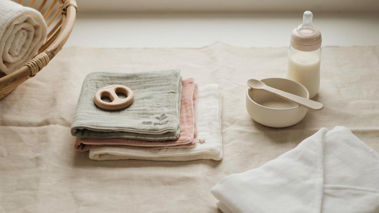 Baby bibs and burp cloths ready for feeding time.