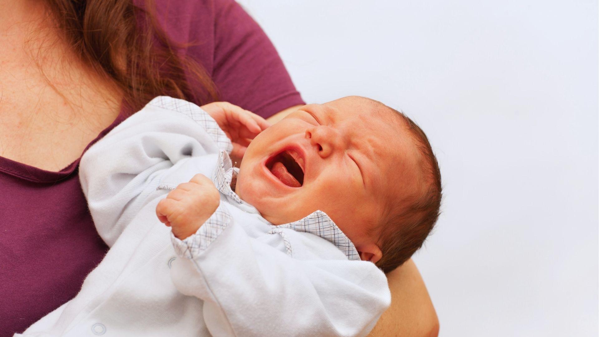 A close-up of a baby crying