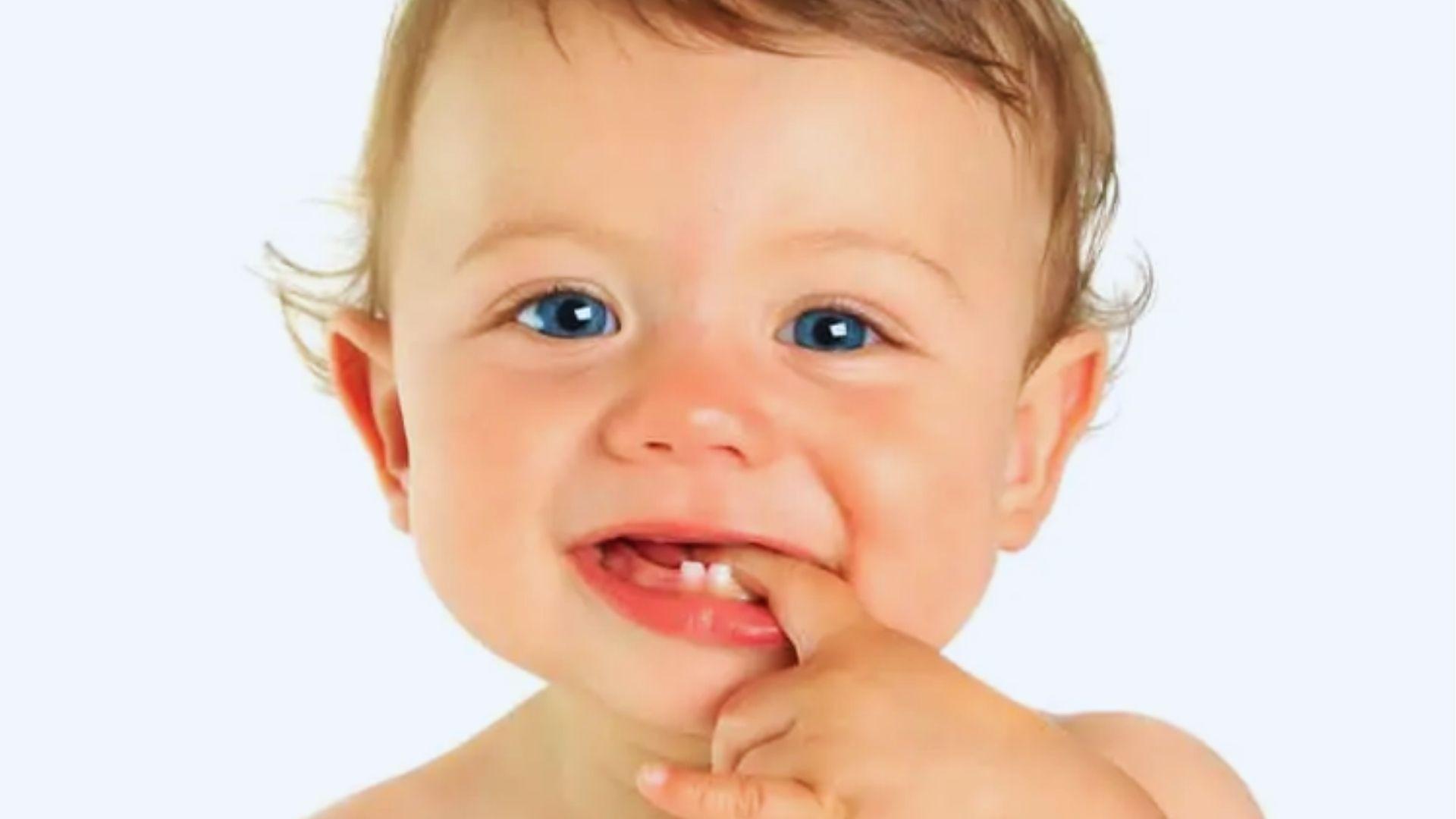 Close-up of a baby biting his finger