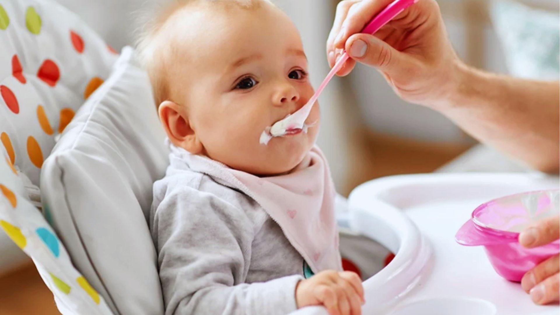 A baby being fed via spoon