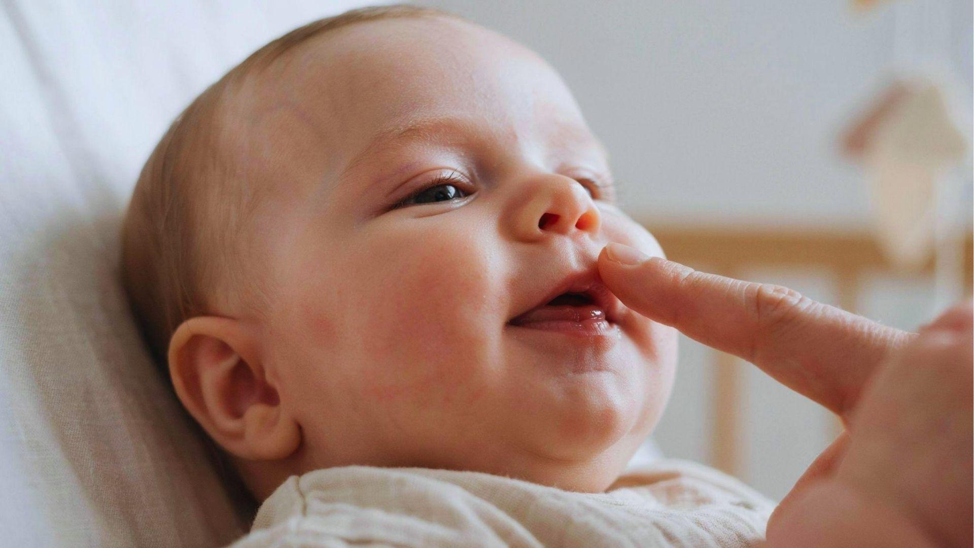 Close-up of a smiling infant.