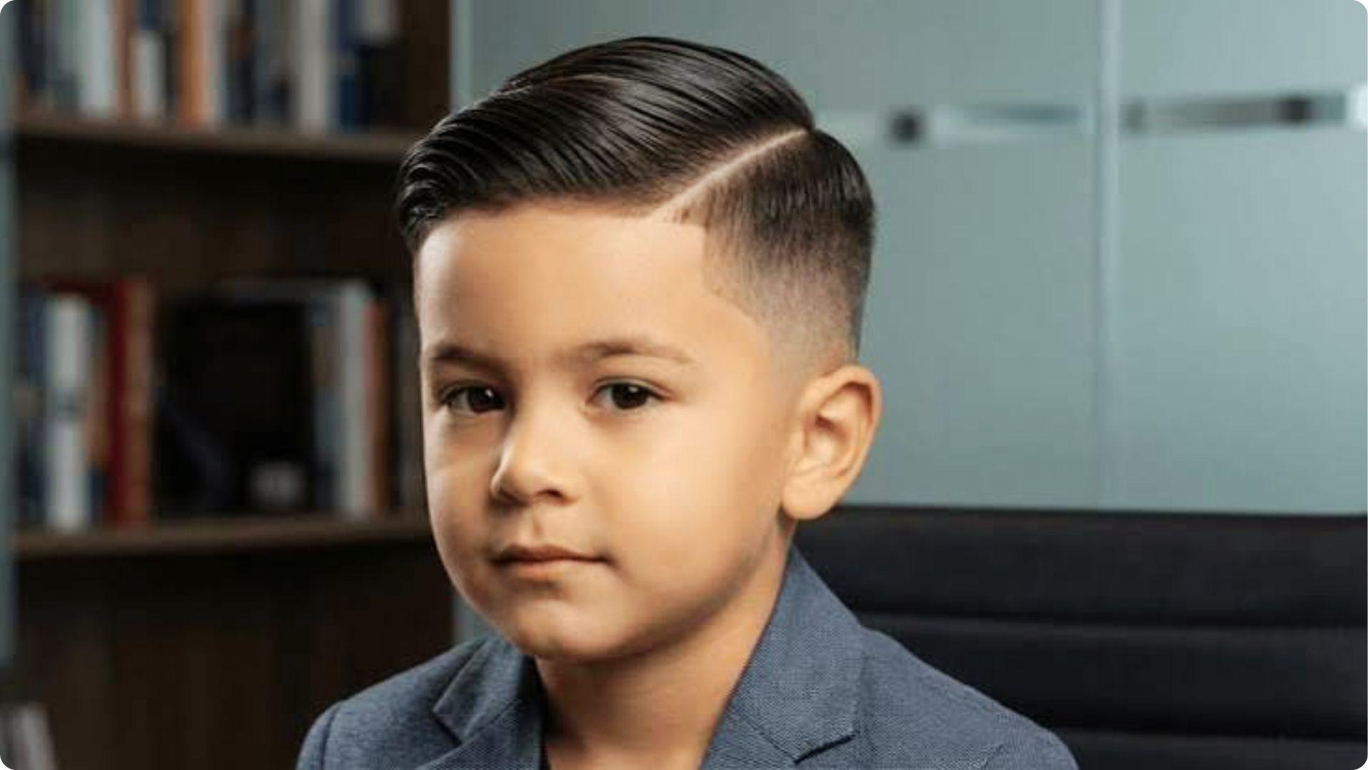 Toddler boy with glossy Short Side-Swept Style comb-over and low skin fade, wearing blazer, neat formal haircut