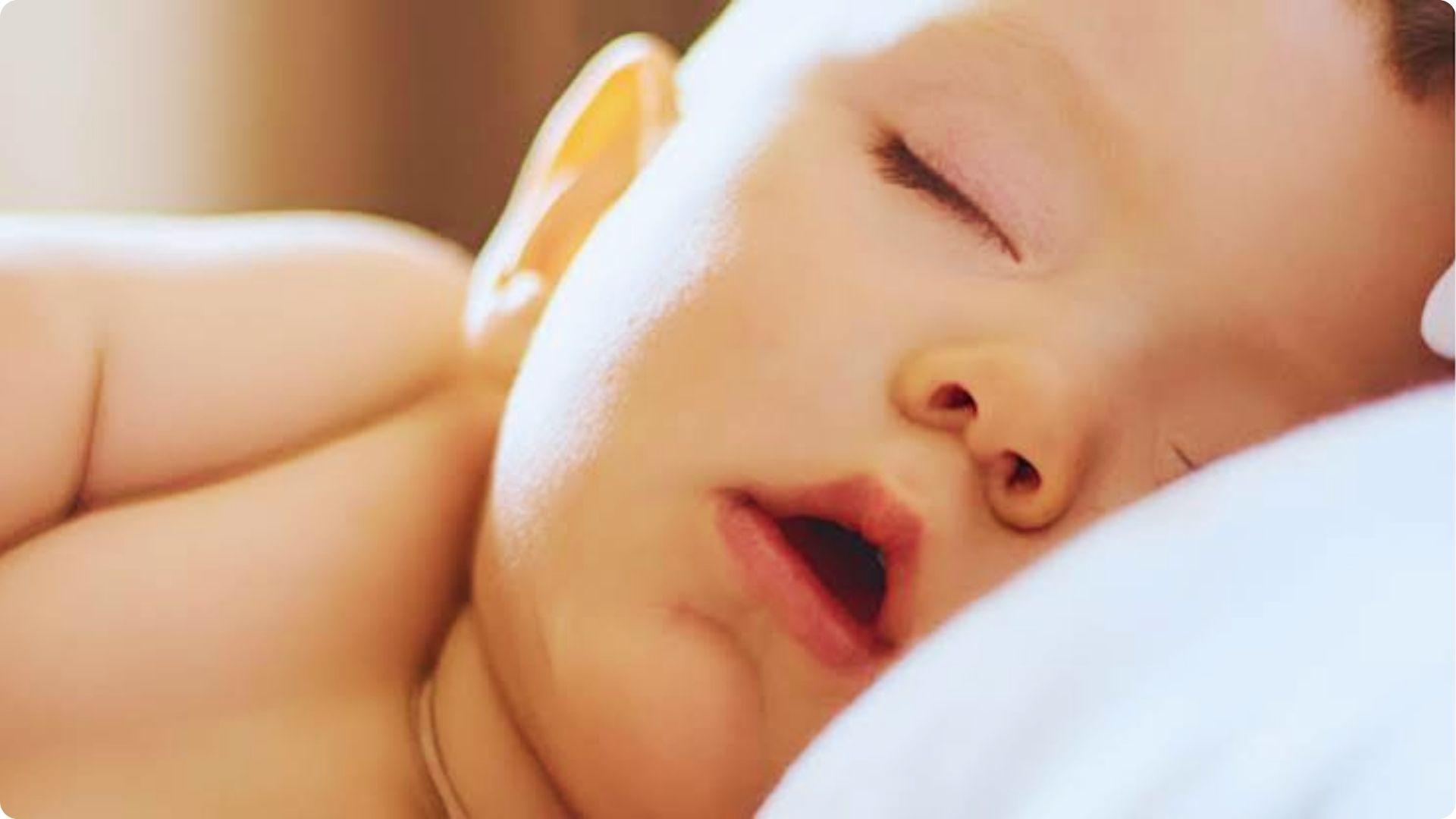 Closeup infant sleeping mouth open softly, delicate breathing and can babies breathe through mouth
