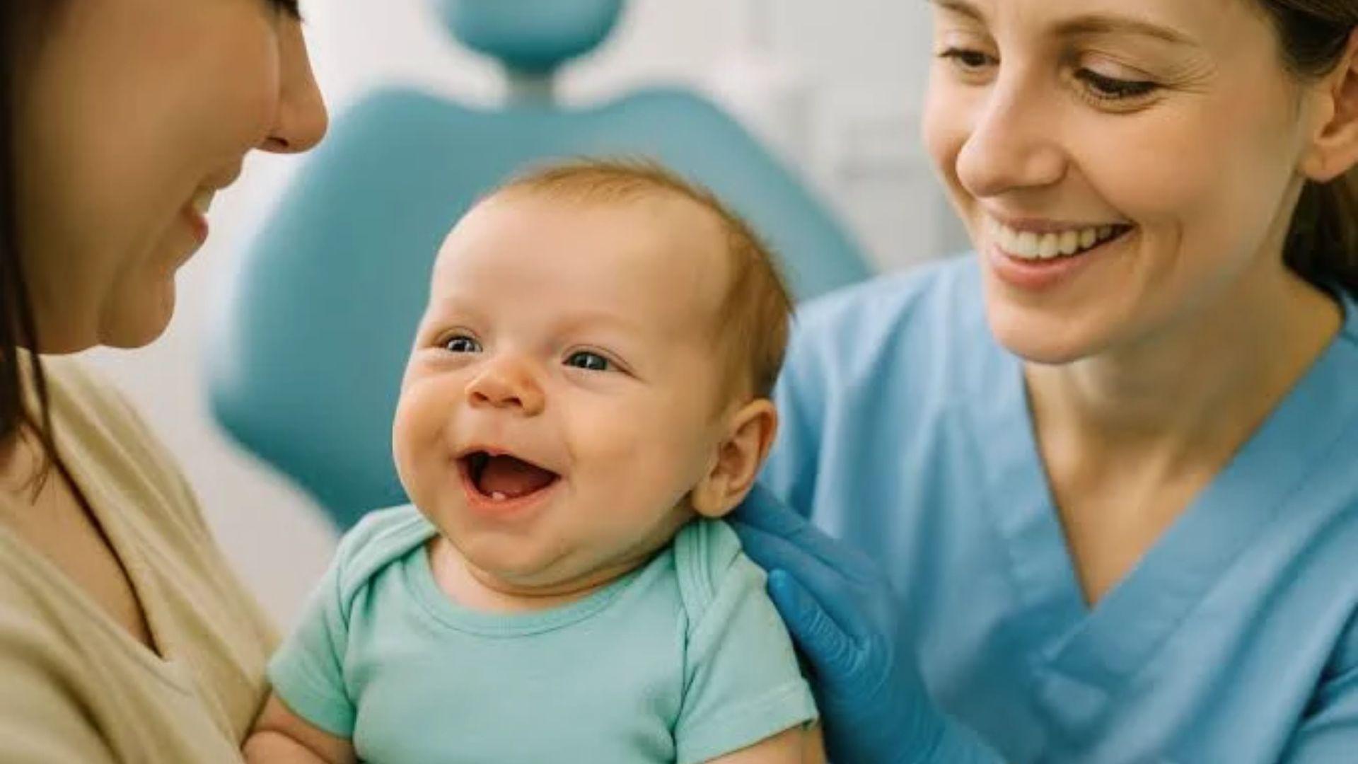 Smiling baby with mother and dentist during checkup.