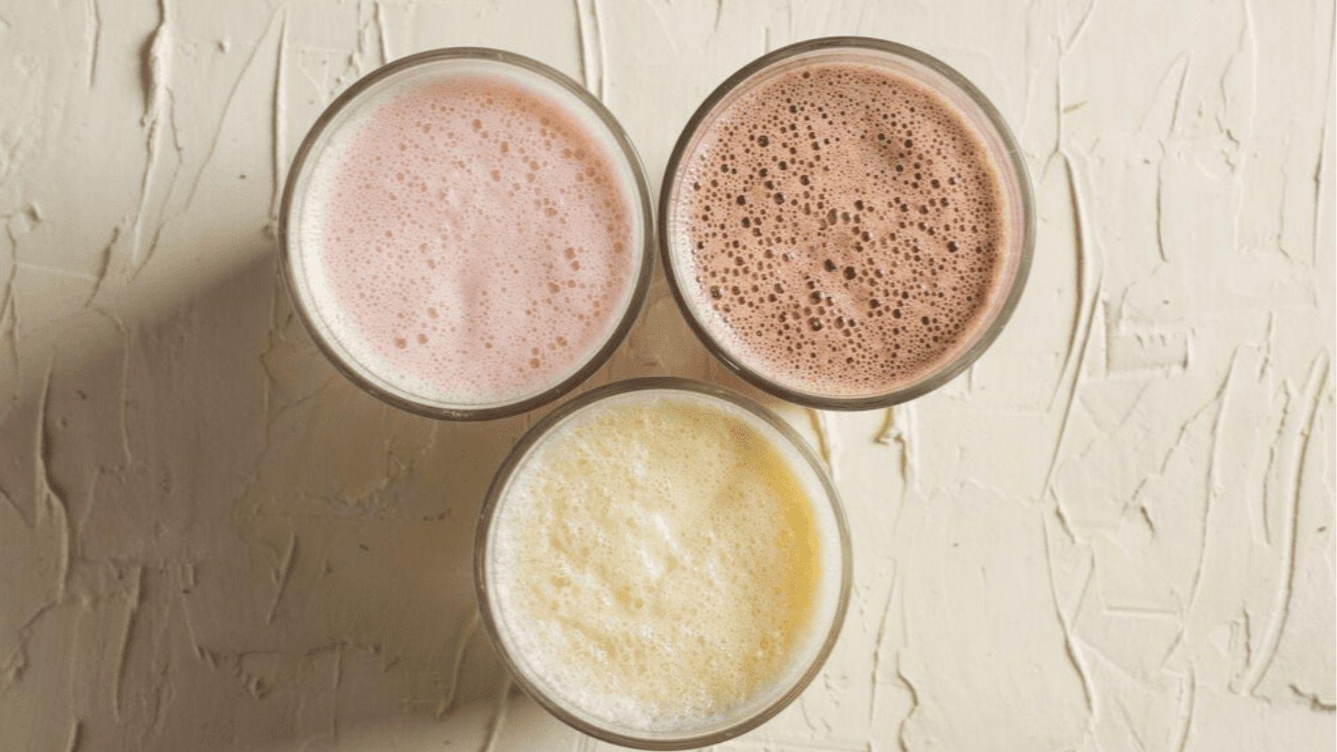 Top view of three flavored milk strawberries, brown chocolate, and yellow mango.
